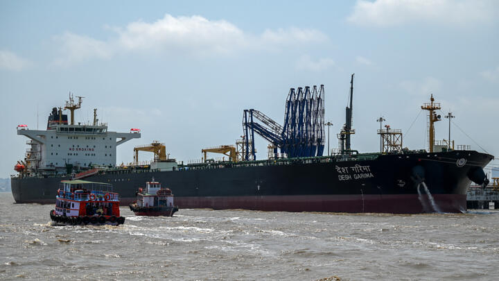 A tanker carrying crude oil that transited through the Strait of Hormuz, is seen docked at an offloading terminal along the coast in Mumbai on April 30, 2026