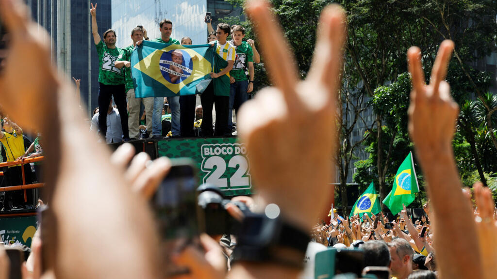 Brazilian senator and presidential candidate Flavio Bolsonaro of the Liberal Party (PL) and Sao Paulo Governor Tarcisio de Freitas attend a rally ahead of the runoff presidential election, in Sao Paulo, Brazil, October 18, 2026.
